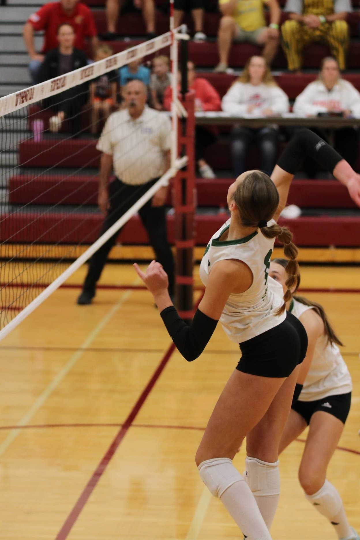 A Kearney Catholic Stars player rises for an attack at the net